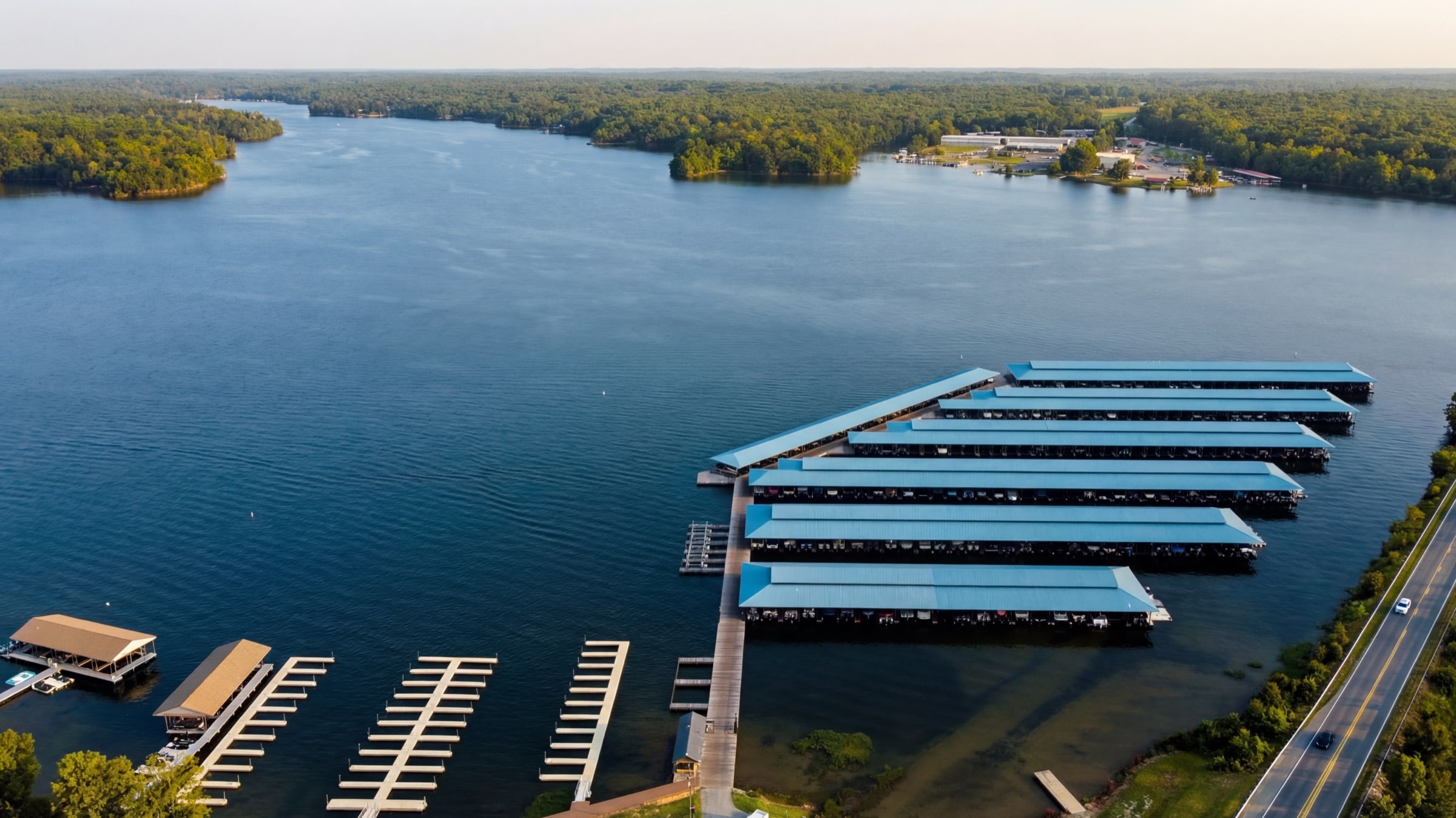 Aerial view of Lake Anna Yacht Club covered slips at golden hour