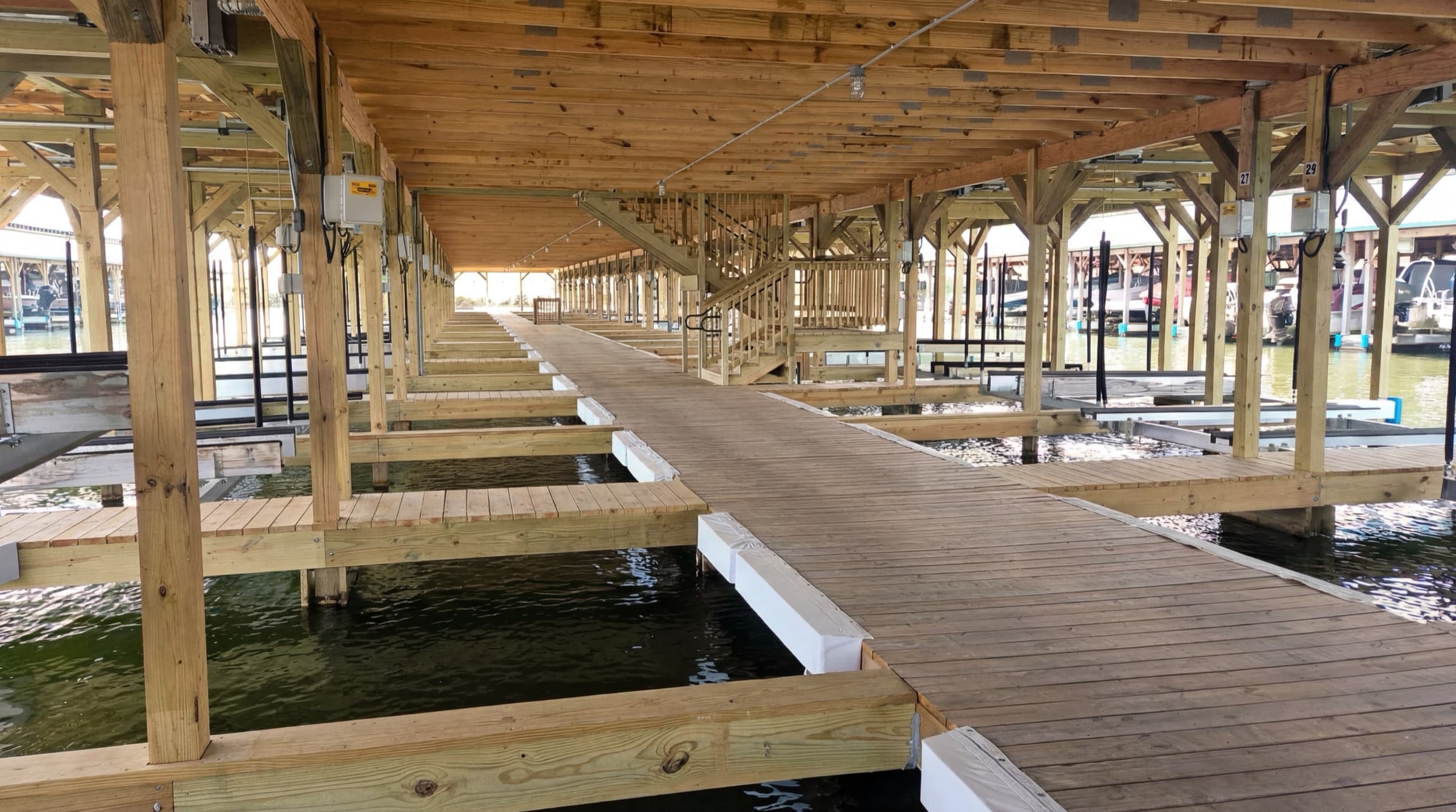 Covered slips with lifts